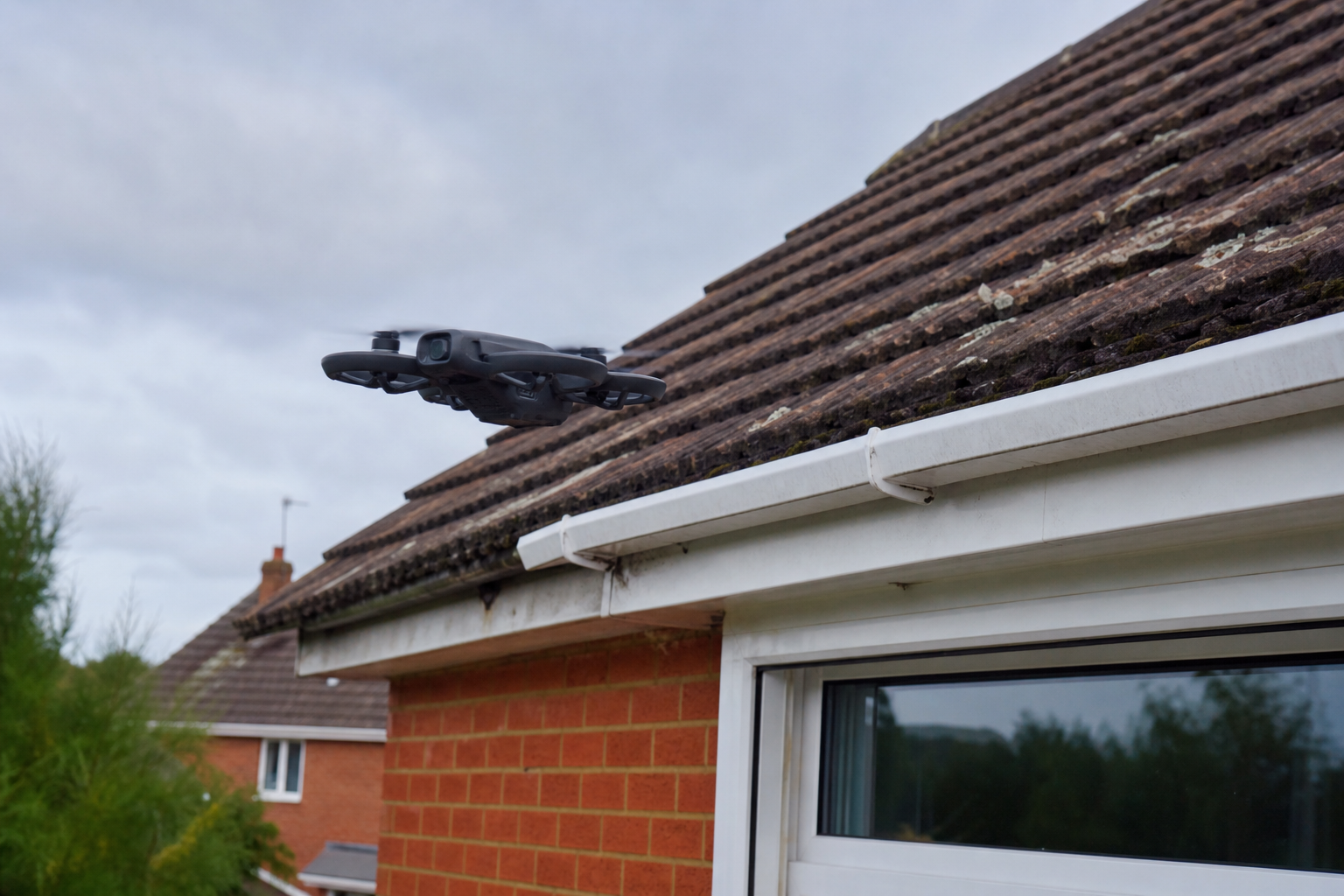 DJI Neo 2 drone inspecting a residential roof in Hampshire