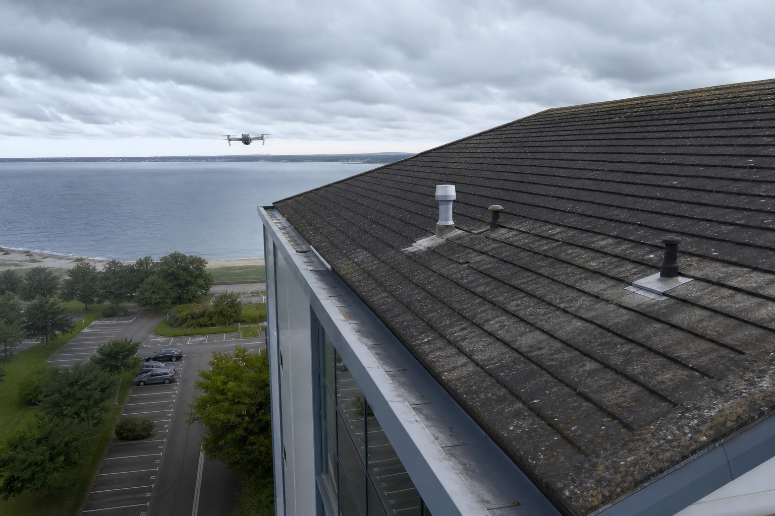 Drone inspecting a Hampshire rooftop for Solent Aero building defect surveys